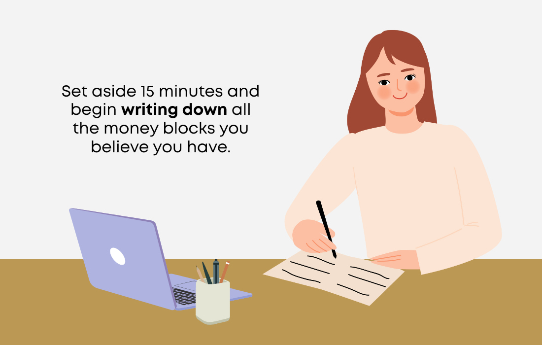 woman writing her money blocks
