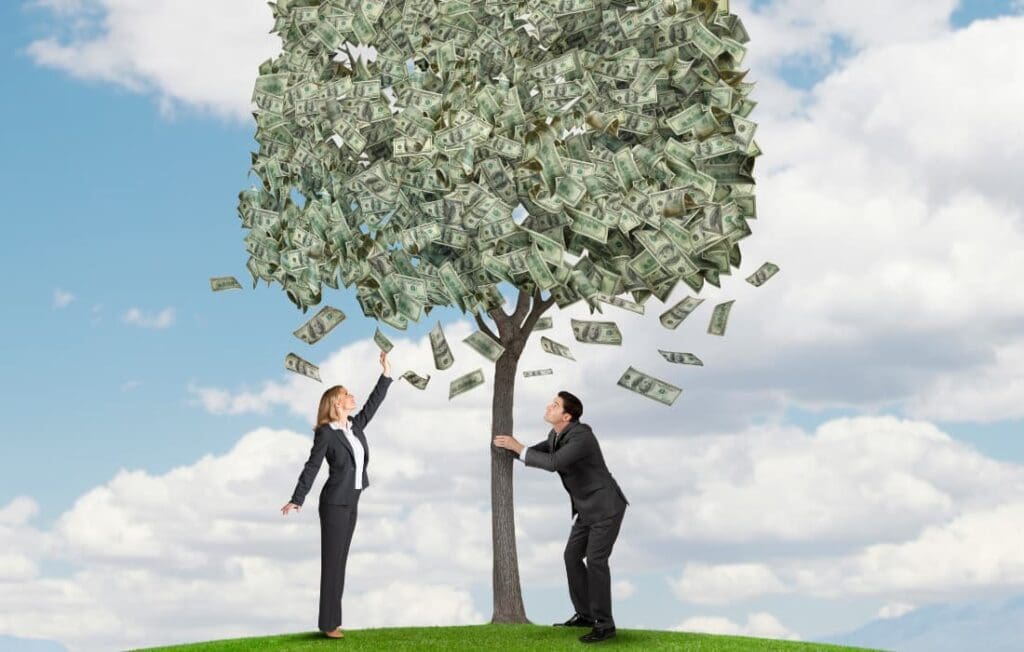 two people shaking a money tree