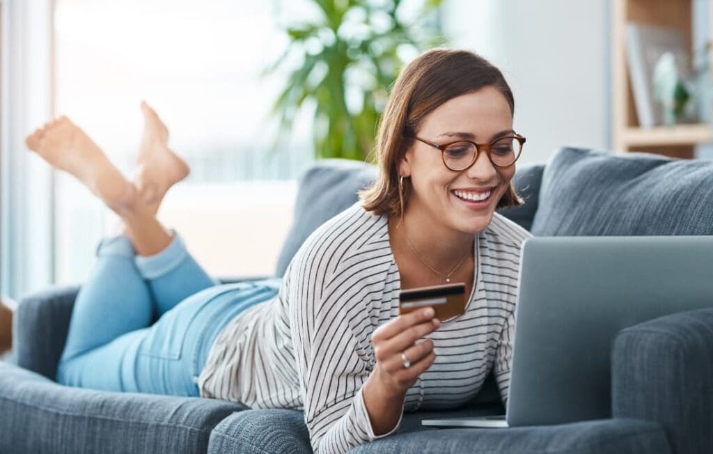 woman online shopping feeling good about her spending