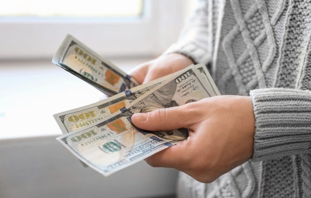 Woman counting her leftover money
